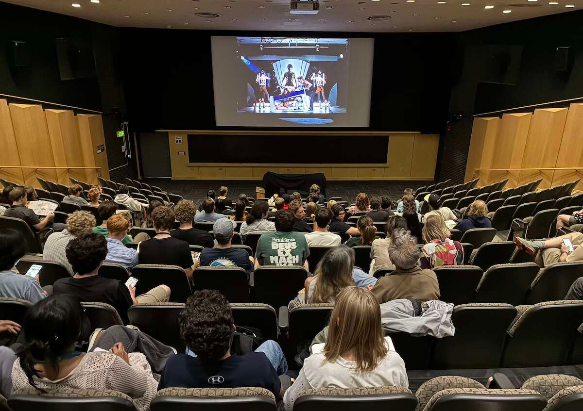 People sit in Muenzinger Auditorium