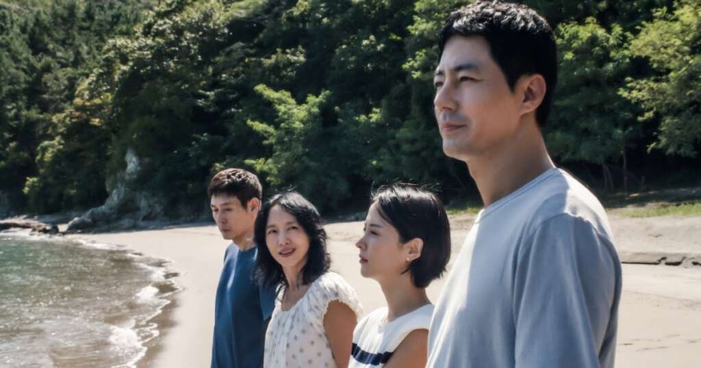 The two families in "Possible Love" stand together on the beach