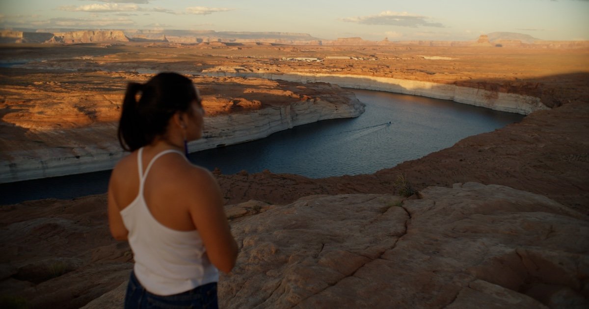 A woman looks out at nature in a scene from "The River"