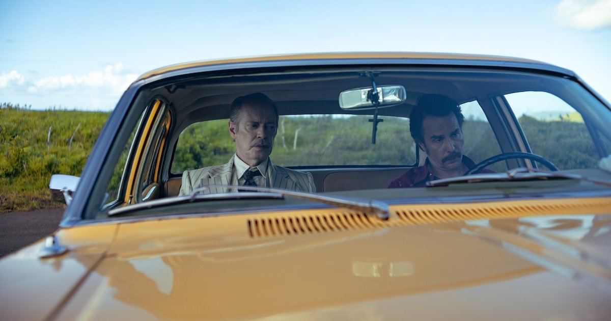 Two people sit in a car